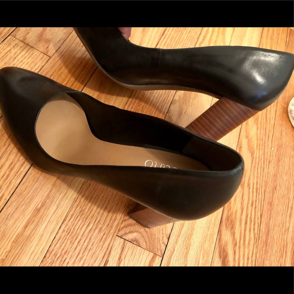 Black leather pumps